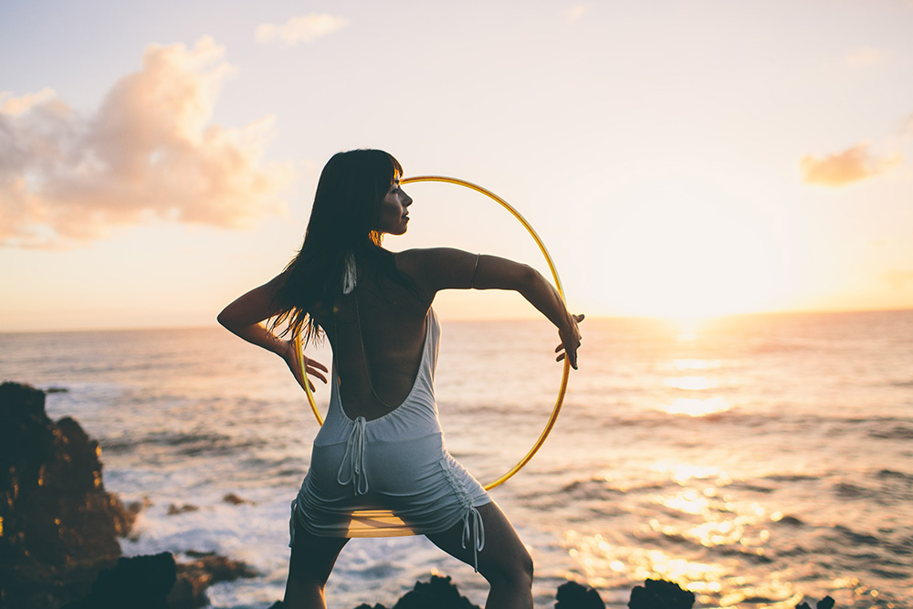 the hula hoop girl at sunrise