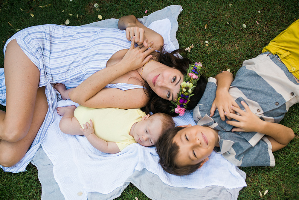 river siver and her family during their backyard family portrait session located in paia, hawaii.