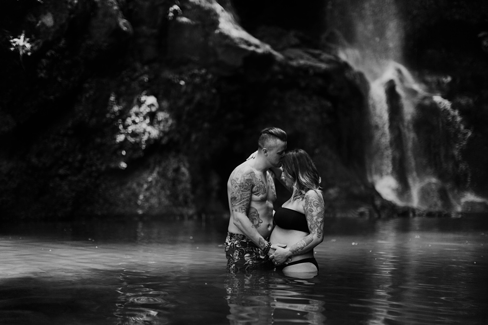 maui maternity and pregnancy photos at a waterfall on the road to hana in hawaii. 