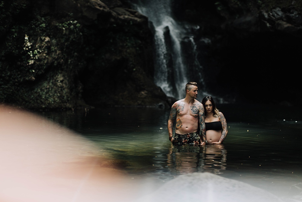 maui maternity and pregnancy photos at a waterfall on the road to hana in hawaii. 