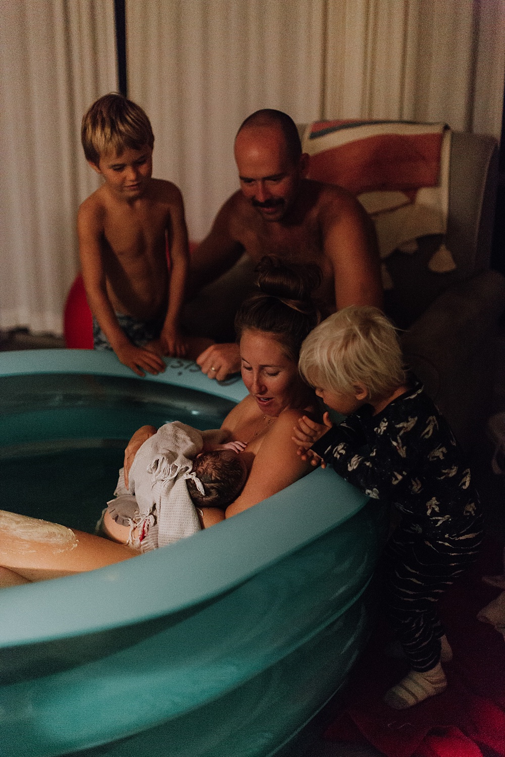 family around the birthing tub