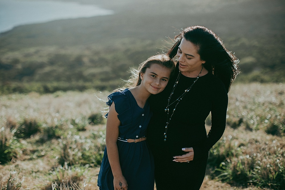 mother and daughter during adventurous family photography session in hawaii. 
