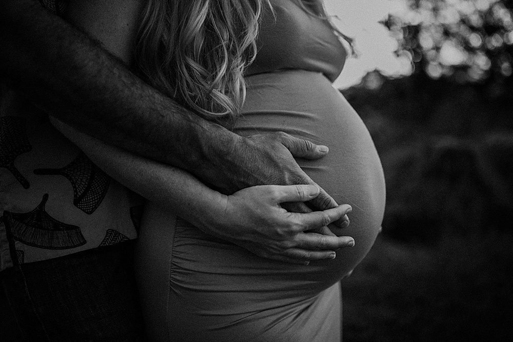 Black and white maternity photo during an in-home session in Hawaii. 