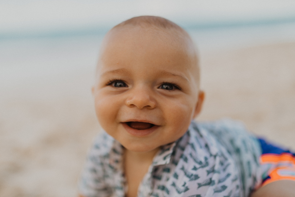 cute little boy during his family photos at kailua beach
