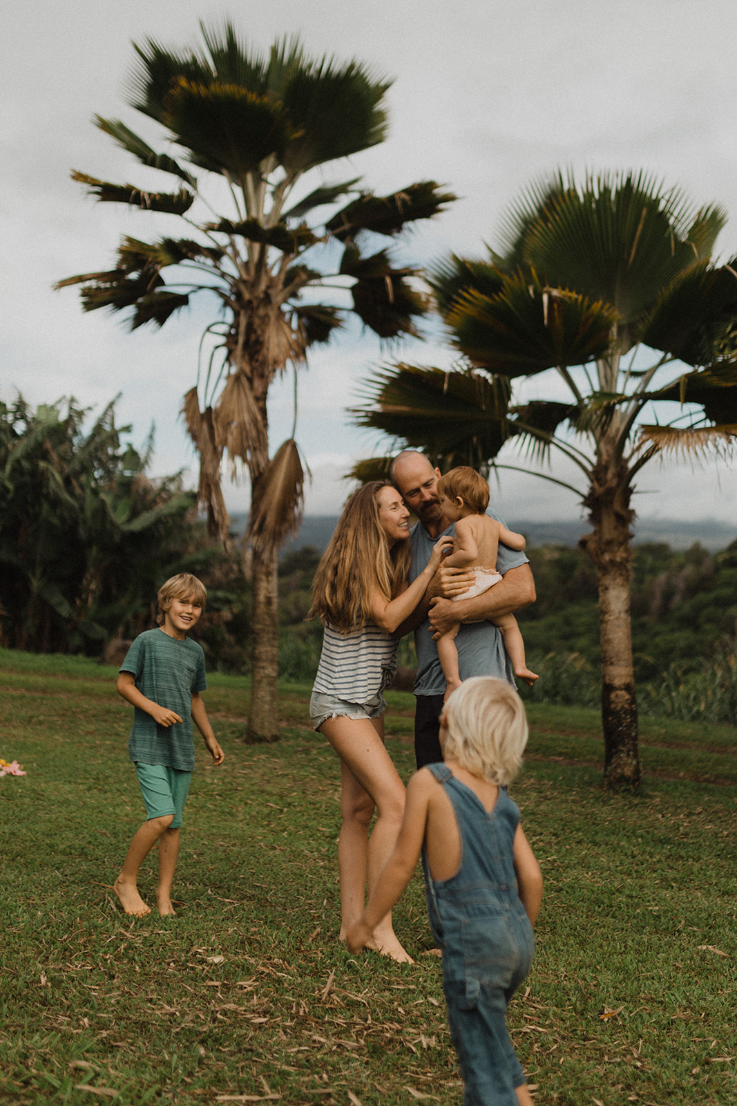 Ellen and Andrew fisher with their children at home on Maui. 