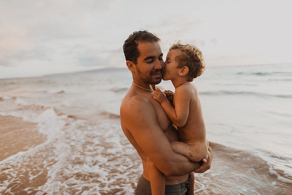 dad and son during family photos at sunset on maui 