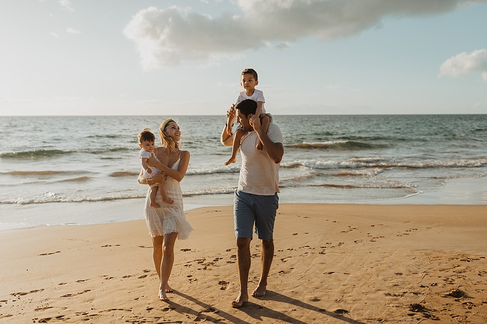 family walking the beach in wailea, hawaii