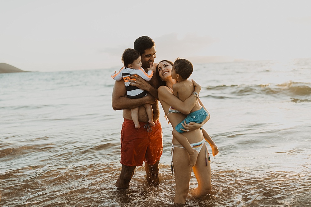 family in water during their photo shoot in maui, hawaii 